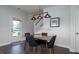 Dining room with modern lighting fixture and easy access to the backyard and stairs at 2017 Geranium Ln, Johns Island, SC 29455