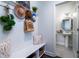 Mud room with storage bench and coat hooks leading into a half bath at 2017 Geranium Ln, Johns Island, SC 29455