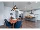 Dining area view of bright kitchen, showcasing large island, stainless appliances, and an open layout at 2017 Geranium Ln, Johns Island, SC 29455