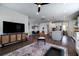 Open-concept layout with kitchen, living, and dining areas, creating a spacious and connected living space at 2017 Geranium Ln, Johns Island, SC 29455