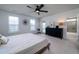 Light-filled primary bedroom with a ceiling fan, ensuite bath, and relaxing decor at 2017 Geranium Ln, Johns Island, SC 29455