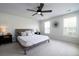 Serene bedroom with neutral tones, a ceiling fan, and large windows for natural light at 2017 Geranium Ln, Johns Island, SC 29455