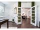 Bright office with glass pane doors leading to a dining room at 2017 Geranium Ln, Johns Island, SC 29455