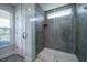 Modern tiled shower with glass door and window providing natural light at 2017 Geranium Ln, Johns Island, SC 29455