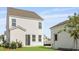 The backyard of the house is fenced and includes a matching detached garage at 212 Terrace View Dr, Summerville, SC 29486