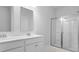 Bright bathroom featuring a glass-enclosed shower and double sink vanity at 212 Terrace View Dr, Summerville, SC 29486