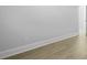 A simple bedroom featuring wood flooring, white walls, and white trim at 212 Terrace View Dr, Summerville, SC 29486