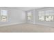 Neutral carpeted bedroom with plenty of natural light from two different windows at 212 Terrace View Dr, Summerville, SC 29486