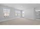 Spacious carpeted bedroom with large windows and door with a view of the outside at 212 Terrace View Dr, Summerville, SC 29486