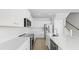 Bright, modern kitchen boasts white cabinets, quartz countertops, stainless steel appliances, and an island at 212 Terrace View Dr, Summerville, SC 29486