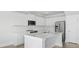 A kitchen with white cabinets and countertops, stainless steel appliances, and a modern design with an island at 212 Terrace View Dr, Summerville, SC 29486