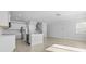 Bright kitchen features stainless steel appliances, white cabinets, and hardwood floors in an open-concept living space at 212 Terrace View Dr, Summerville, SC 29486