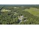 Aerial view showcasing the neighborhood's wooded landscape and the location of the home at 214 Deer Ridge Court Ct, Huger, SC 29450