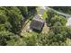 Aerial view of fenced backyard with patio and deck at 214 Deer Ridge Court Ct, Huger, SC 29450