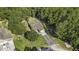 Aerial view of a home with a long driveway surrounded by lush greenery, creating a private setting at 214 Deer Ridge Court Ct, Huger, SC 29450