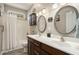 Bathroom featuring double sinks, a shower and bath, cabinets and hardwood floors at 214 Deer Ridge Court Ct, Huger, SC 29450