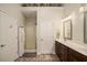 Bathroom with shower, double sinks, and bright lighting at 214 Deer Ridge Court Ct, Huger, SC 29450