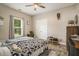 Bedroom with a ceiling fan, a window and neutral colored walls and hardwood floors at 214 Deer Ridge Court Ct, Huger, SC 29450