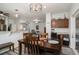 Open-concept dining area with wooden table and access to the living room at 214 Deer Ridge Court Ct, Huger, SC 29450