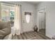 Welcoming foyer with decorative front door, hardwood floors, and neutral paint at 214 Deer Ridge Court Ct, Huger, SC 29450