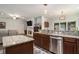 Spacious kitchen with island, stainless appliances, and open layout to living room at 214 Deer Ridge Court Ct, Huger, SC 29450