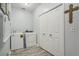 Laundry room featuring a washer, dryer, utility closet and hardwood floors at 214 Deer Ridge Court Ct, Huger, SC 29450