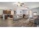 Spacious living room with hardwood floors, comfortable seating, and an open layout to kitchen at 214 Deer Ridge Court Ct, Huger, SC 29450