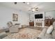 Bright living room features a fireplace, plush seating, and stylish decor at 214 Deer Ridge Court Ct, Huger, SC 29450