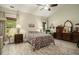 Cozy main bedroom with vaulted ceiling, ceiling fan, and warm decor at 214 Deer Ridge Court Ct, Huger, SC 29450