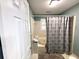Cozy bathroom featuring a tub and shower combination with a shower curtain and neutral-colored tile at 2206 Hunter Creek Dr, Charleston, SC 29414