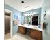 Bright bathroom featuring a double vanity with white countertops and updated fixtures with blue walls at 2206 Hunter Creek Dr, Charleston, SC 29414
