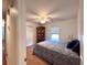 Comfortable bedroom featuring wood floors, a ceiling fan, and a large bed with blue and gray paisley bedding at 2206 Hunter Creek Dr, Charleston, SC 29414