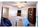 Well-lit bedroom with wood floors, closet, and cozy patterned bed set near the window at 2206 Hunter Creek Dr, Charleston, SC 29414