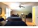 Bright bedroom with a ceiling fan, desk, bookcase, and natural light from large window at 2206 Hunter Creek Dr, Charleston, SC 29414
