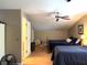 Spacious bedroom featuring hardwood floors, ceiling fan, and two comfortable beds at 2206 Hunter Creek Dr, Charleston, SC 29414