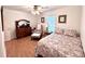 Comfortable bedroom with wood floors, a twin bed, armchair, and a classic wooden dresser at 2206 Hunter Creek Dr, Charleston, SC 29414