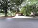 Charming red brick home with a two-car garage and a long, spacious driveway at 2206 Hunter Creek Dr, Charleston, SC 29414