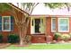 Inviting front entrance featuring a brick facade, well-maintained landscaping, and a cozy entryway at 2206 Hunter Creek Dr, Charleston, SC 29414