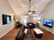 Bright living room with a vaulted ceiling, hardwood floors, and comfortable leather seating at 2206 Hunter Creek Dr, Charleston, SC 29414