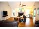 Warm living room showcasing hardwood floors, a cozy fireplace, and ample natural light at 2206 Hunter Creek Dr, Charleston, SC 29414