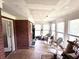 Bright sunroom with large windows, brick accents, and a variety of seating options at 2206 Hunter Creek Dr, Charleston, SC 29414