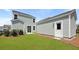 Backyard with a small lawn and additional storage with white doors at 222 Terrace View Dr, Summerville, SC 29486