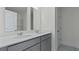 Modern bathroom featuring a double vanity with framed mirrors and gray cabinetry at 222 Terrace View Dr, Summerville, SC 29486