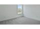 Comfortable bedroom features a large window and neutral gray carpet to complete a cozy living space at 222 Terrace View Dr, Summerville, SC 29486