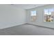 Bright bedroom with two large windows providing plenty of natural light and neighborhood views at 222 Terrace View Dr, Summerville, SC 29486