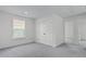 Cozy bedroom with neutral gray carpet, white trim, and a double door closet perfect for any style at 222 Terrace View Dr, Summerville, SC 29486