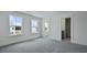 Bedroom featuring three large windows that let in tons of light and doorway to an en-suite bathroom at 222 Terrace View Dr, Summerville, SC 29486