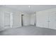 Bright bedroom with neutral walls, carpet, and trim features multiple doors at 222 Terrace View Dr, Summerville, SC 29486