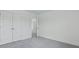 Bedroom featuring neutral gray carpet, large closets, and a doorway to the Primary bathroom at 222 Terrace View Dr, Summerville, SC 29486