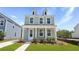 Charming two-story home with a covered front porch and a manicured lawn at 222 Terrace View Dr, Summerville, SC 29486